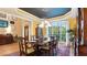 Formal dining room with detailed trim, coffered ceiling, and large windows overlooking a wooded lot at 104 Kremer Falls Trce, Canton, GA 30114