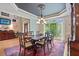 Traditional dining room featuring tray ceilings, detailed trim and molding, and large bay window at 104 Kremer Falls Trce, Canton, GA 30114