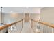 Upstairs hallway with carpet floors and white railings at 104 Kremer Falls Trce, Canton, GA 30114