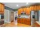 Gourmet kitchen features stainless steel appliances, custom cabinetry, granite countertops and wood flooring at 104 Kremer Falls Trce, Canton, GA 30114