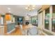 Kitchen with breakfast nook, granite countertops, stainless appliances and view of stone fireplace and living room at 104 Kremer Falls Trce, Canton, GA 30114