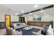 Spacious living room with comfortable seating, a large rug, and recessed lighting, perfect for gatherings at 104 Kremer Falls Trce, Canton, GA 30114