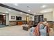 Cozy living room with a fireplace, plush seating, a wooden coffee table, and warm ambient lighting at 104 Kremer Falls Trce, Canton, GA 30114