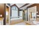 Features a large soaking tub, and a separate shower, and a view of the main bedroom at 104 Kremer Falls Trce, Canton, GA 30114