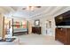The main bedroom features a large four-poster bed, a TV, and access to the bathroom at 104 Kremer Falls Trce, Canton, GA 30114
