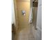 Bathroom featuring a shower with tile surround, door to toilet and linen storage at 2991 Greyhawk Ln, Cumming, GA 30040