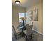 Bright dining room features a glass table, rug, and elegant decor at 2991 Greyhawk Ln, Cumming, GA 30040