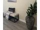 Entryway with a decorative bench, plant, and gray floors at 2991 Greyhawk Ln, Cumming, GA 30040