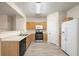 Bright kitchen featuring wood cabinets, stainless steel appliances, and laminate flooring at 2991 Greyhawk Ln, Cumming, GA 30040