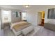 Bright, carpeted bedroom with neutral tones, abundant natural light, and minimalist decor at 7771 Sudbury Cir, Covington, GA 30014