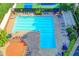Aerial view of the community pool and tennis courts, complemented with plenty of seating at 9770 Rod Rd, Alpharetta, GA 30022