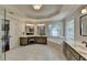 Luxury bathroom featuring a soaking tub, dual vanities, and a private shower at 9770 Rod Rd, Alpharetta, GA 30022