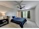Comfortable bedroom with plush carpet, ceiling fan, and natural light at 9770 Rod Rd, Alpharetta, GA 30022