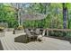 Relaxing outdoor deck with table, chairs and umbrella at 9770 Rod Rd, Alpharetta, GA 30022