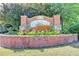 Community entrance sign with manicured landscaping at 9770 Rod Rd, Alpharetta, GA 30022