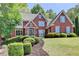 Charming brick home with landscaped front yard at 9770 Rod Rd, Alpharetta, GA 30022