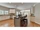 Modern kitchen featuring a central island, stainless steel appliances, and an open layout at 9770 Rod Rd, Alpharetta, GA 30022