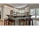 Modern kitchen with granite countertops, white cabinets, and stainless steel appliances at 9770 Rod Rd, Alpharetta, GA 30022