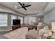 Comfortable living room with a large sectional sofa and plenty of natural light at 9770 Rod Rd, Alpharetta, GA 30022
