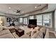 Open living area with a large sofa, exercise bike, and doors leading to a patio at 9770 Rod Rd, Alpharetta, GA 30022
