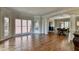 Spacious living room with hardwood floors, large windows, and elegant architectural details at 9770 Rod Rd, Alpharetta, GA 30022