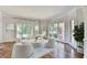 Cozy living room filled with natural light featuring hardwood floors and neutral decor at 9770 Rod Rd, Alpharetta, GA 30022