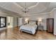 Spacious bedroom featuring a trey ceiling and hardwood floors at 9770 Rod Rd, Alpharetta, GA 30022