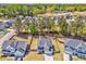 An aerial view showcases the well-manicured lawns and landscaping of a home in a quiet community at 1302 Gardenia Ct, Villa Rica, GA 30180