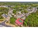 Community aerial shot showing houses, landscaping, and a red basketball/tennis court at 1302 Gardenia Ct, Villa Rica, GA 30180