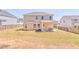 Spacious backyard featuring a patio, lush grass, and a wooden fence for privacy at 1302 Gardenia Ct, Villa Rica, GA 30180