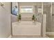 Bathroom with soaking tub and separate shower at 1302 Gardenia Ct, Villa Rica, GA 30180