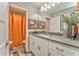Stylish bathroom showcasing modern fixtures, a vibrant shower curtain, and elegant decor accents at 1302 Gardenia Ct, Villa Rica, GA 30180