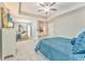Bedroom with tray ceiling, nice carpet and a lovely blue decor at 1302 Gardenia Ct, Villa Rica, GA 30180