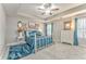 Bedroom with tray ceiling, nice carpet and a lovely blue decor at 1302 Gardenia Ct, Villa Rica, GA 30180