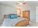 Comfortable bedroom features a spacious bed, soft lighting, and a classic wooden dresser for ample storage at 1302 Gardenia Ct, Villa Rica, GA 30180