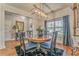 Cozy dining room featuring wainscoting, an elegant light fixture, and stylish decor at 1302 Gardenia Ct, Villa Rica, GA 30180