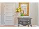 Foyer with hardwood floors and a decorative table and mirror at 1302 Gardenia Ct, Villa Rica, GA 30180