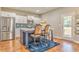 Kitchen features a blue island with stainless steel appliances and white cabinetry at 1302 Gardenia Ct, Villa Rica, GA 30180