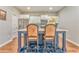 Kitchen island with seating, stainless appliances, and white cabinets at 1302 Gardenia Ct, Villa Rica, GA 30180