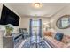 Comfortable living room showcasing modern decor, a large TV, and ample seating for relaxation and entertainment at 1302 Gardenia Ct, Villa Rica, GA 30180