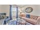 Cozy living room features plush seating, stylish decor, and a window offering natural light and neighborhood views at 1302 Gardenia Ct, Villa Rica, GA 30180
