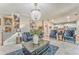 Large living room featuring plush seating, staircase, and a view into the kitchen at 1302 Gardenia Ct, Villa Rica, GA 30180