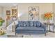Living room area features plush sofa and staircase at 1302 Gardenia Ct, Villa Rica, GA 30180
