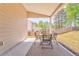 A cozy, covered patio with an outdoor dining set, great for al fresco meals and relaxation at 1302 Gardenia Ct, Villa Rica, GA 30180