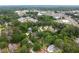 An aerial view of a residential neighborhood with tree-lined streets, manicured lawns, and homes of various architectural styles at 2356 Pinkney Dr, Marietta, GA 30062