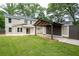 Lush backyard with a covered parking area attached to the house provides both function and beauty at 2356 Pinkney Dr, Marietta, GA 30062