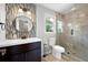 Well-lit bathroom featuring modern vanity, toilet, and glass enclosed shower at 2356 Pinkney Dr, Marietta, GA 30062
