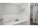 Modern bathroom featuring a jacuzzi tub, tiled floor, and walk-in shower at 2356 Pinkney Dr, Marietta, GA 30062