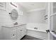 Bathroom with soaking tub, marble countertops, and modern fixtures at 2356 Pinkney Dr, Marietta, GA 30062