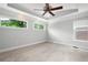 Bedroom with large windows, ceiling fan, and neutral carpet and paint at 2356 Pinkney Dr, Marietta, GA 30062